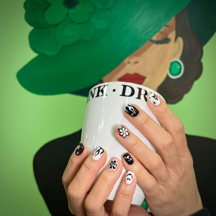Black and white nails with painted daisies