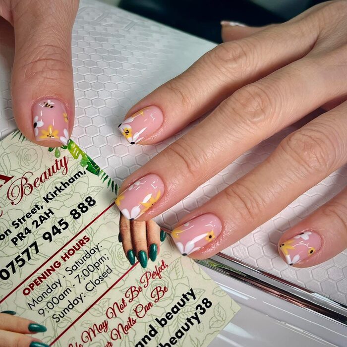 French nails with small yellow flowers